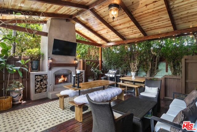 a outdoor space with patio fireplace and furniture