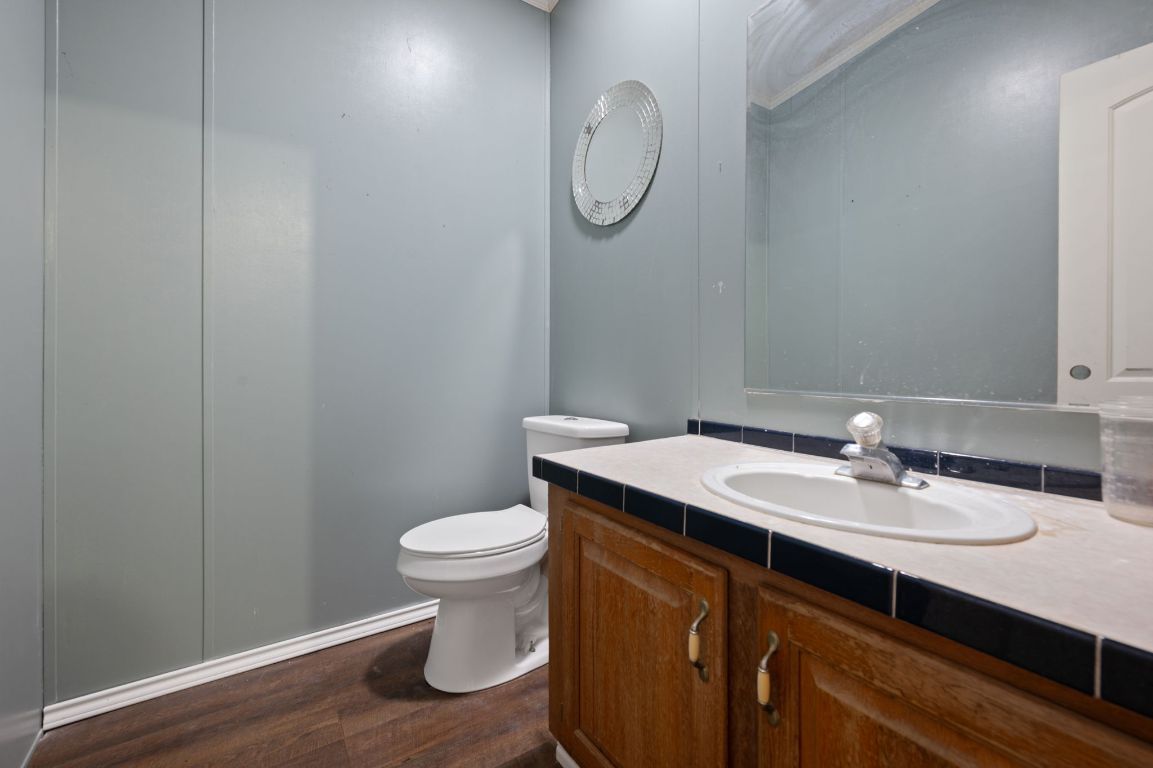 1600 County Road 465 Elgin, TX 78621 - Photo 12 of 25 a bathroom with a sink a toilet and shower