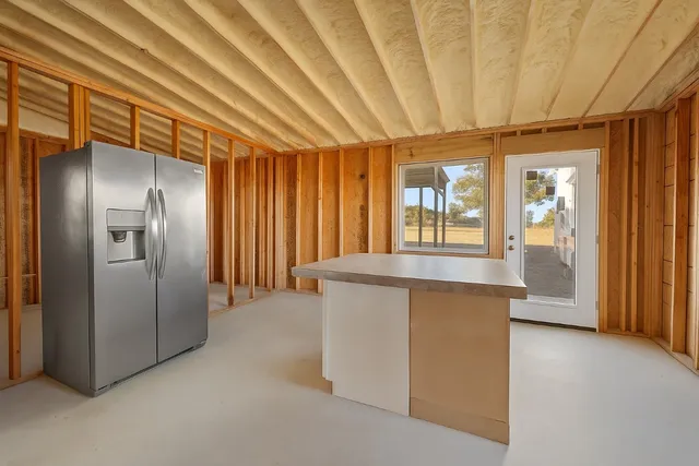 a view of an empty room with a fireplace
