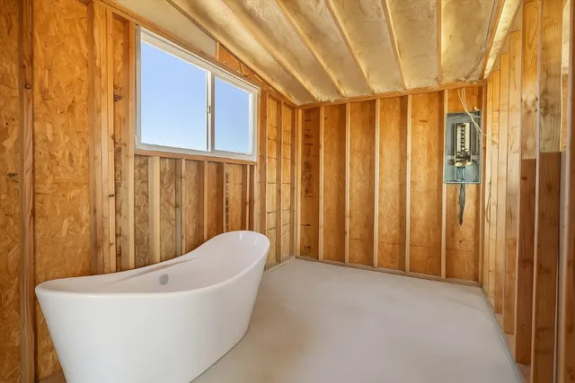 a bathroom with a bathtub and shower