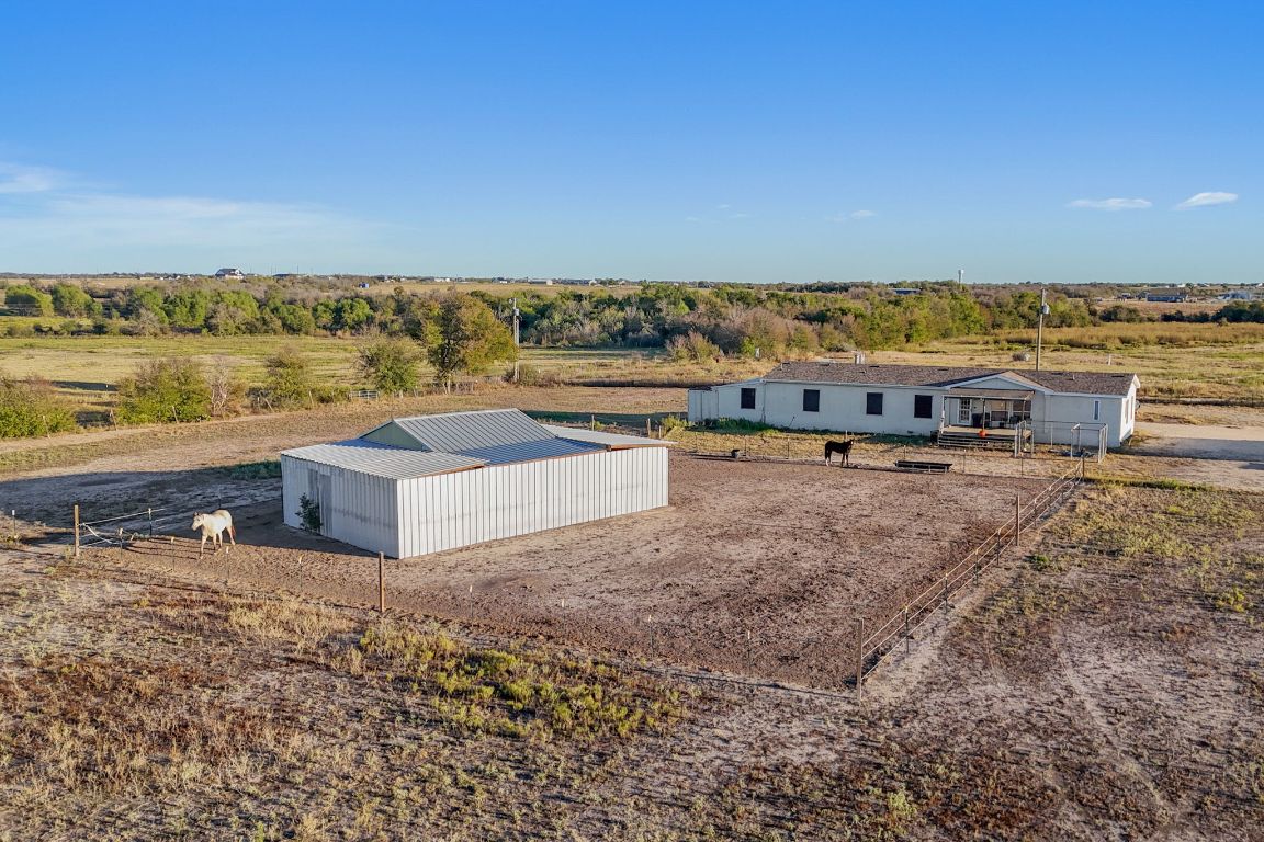 1600 County Road 465 Elgin, TX 78621 - Photo 2 of 25 an aerial view of residential building and ocean view