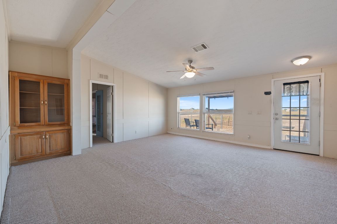 1600 County Road 465 Elgin, TX 78621 - Photo 5 of 25 a view of an empty room with a window