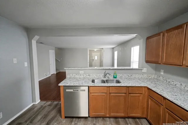 a bathroom with granite countertop a sink