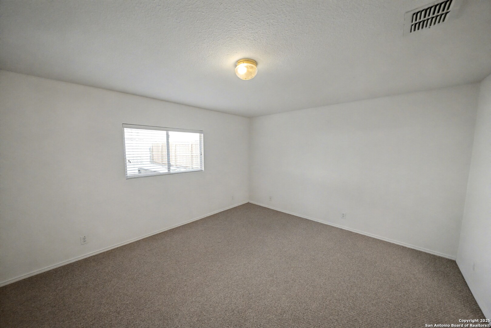 3615 Longhorn Creek San Antonio, TX 78261 - Photo 16 of 42 an empty room with a window