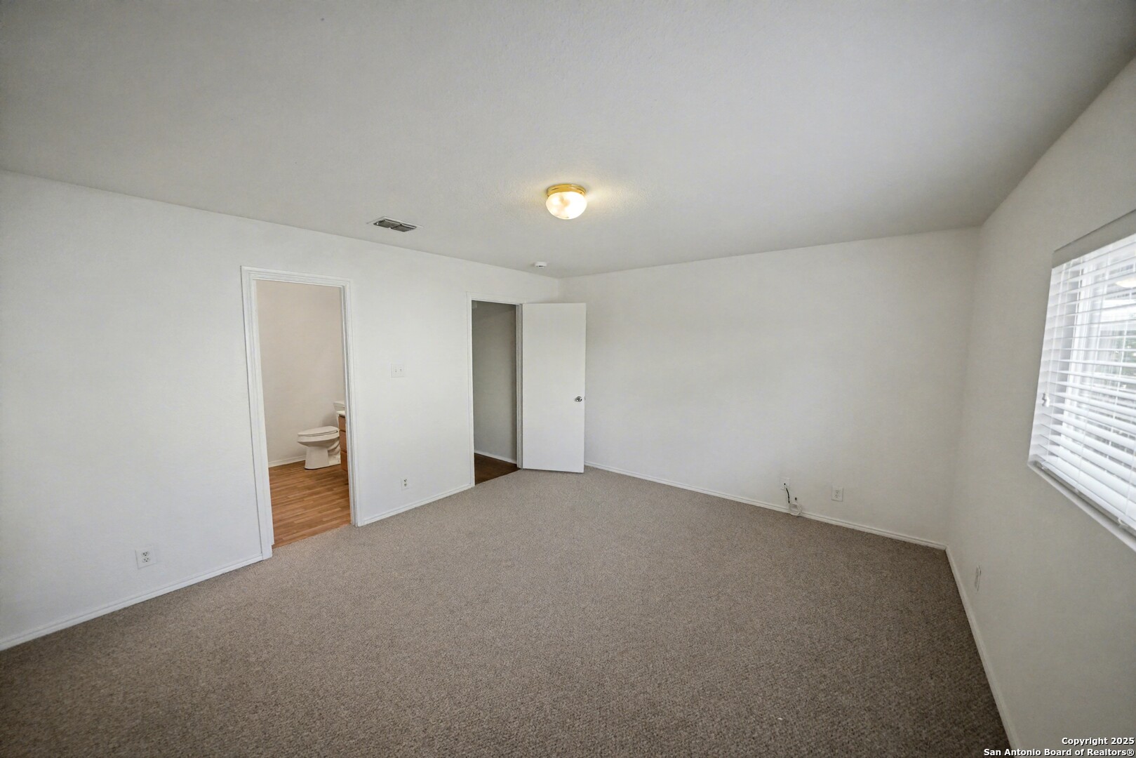3615 Longhorn Creek San Antonio, TX 78261 - Photo 18 of 42 an empty room with windows