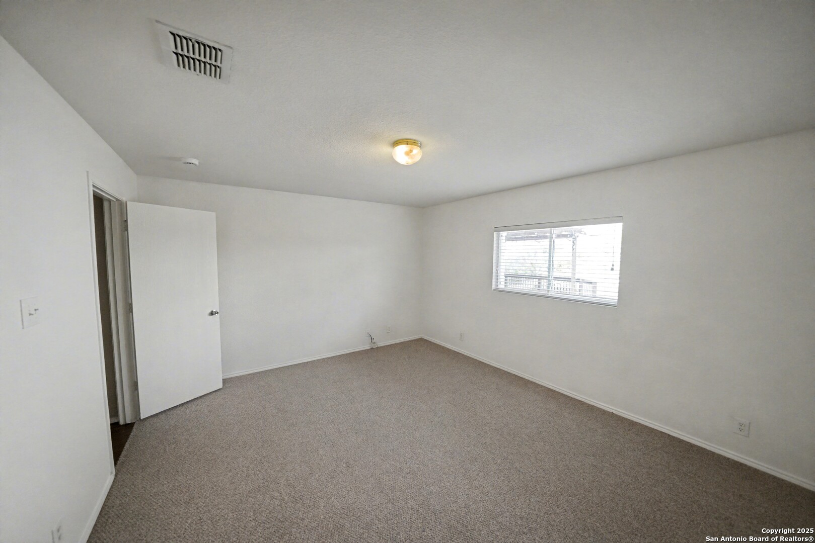 3615 Longhorn Creek San Antonio, TX 78261 - Photo 19 of 42 a view of an empty room with a window