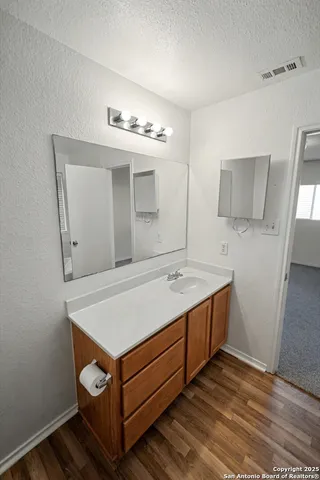 a room with a sink and cabinets