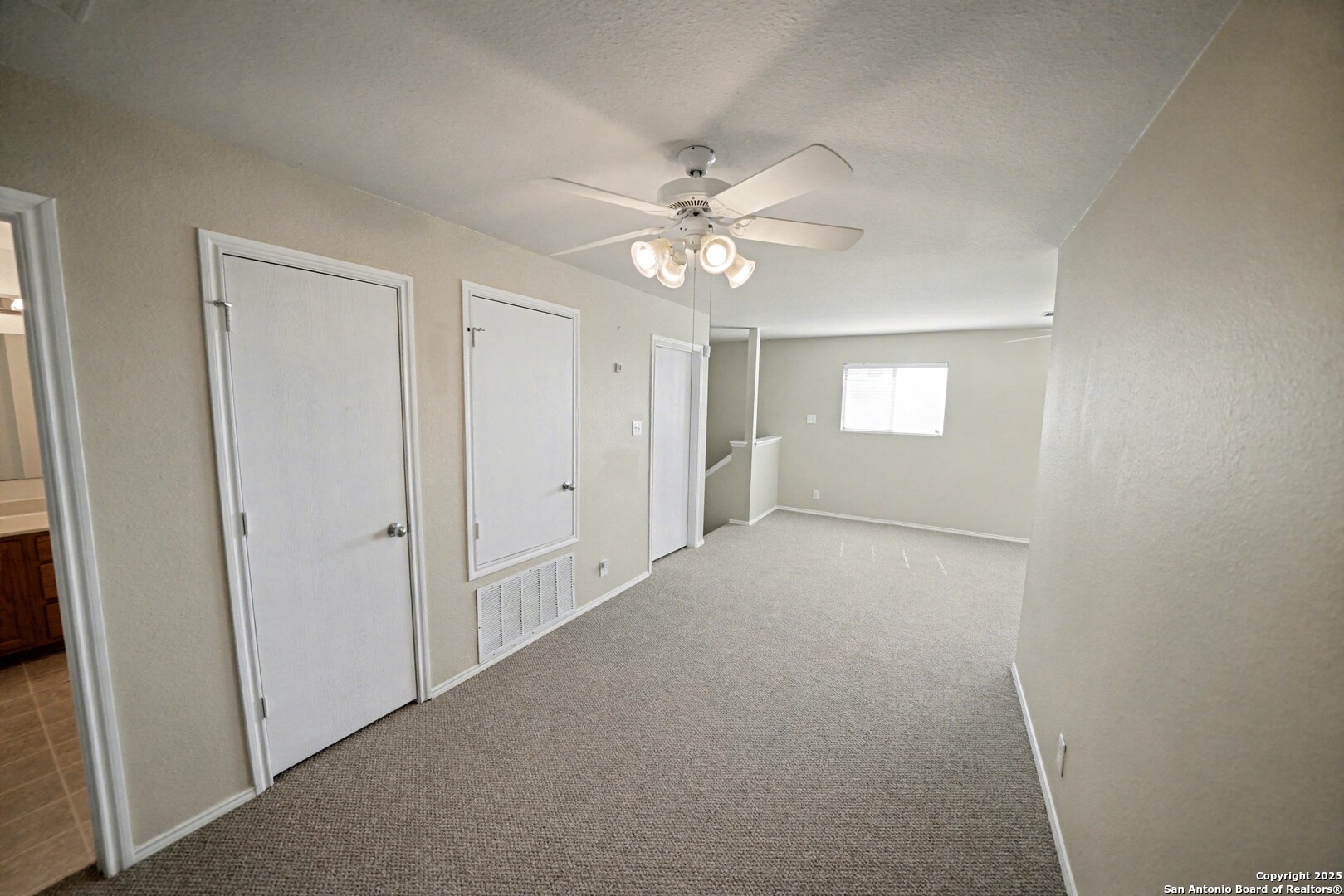 3615 Longhorn Creek San Antonio, TX 78261 - Photo 25 of 42 an empty room with fan and windows
