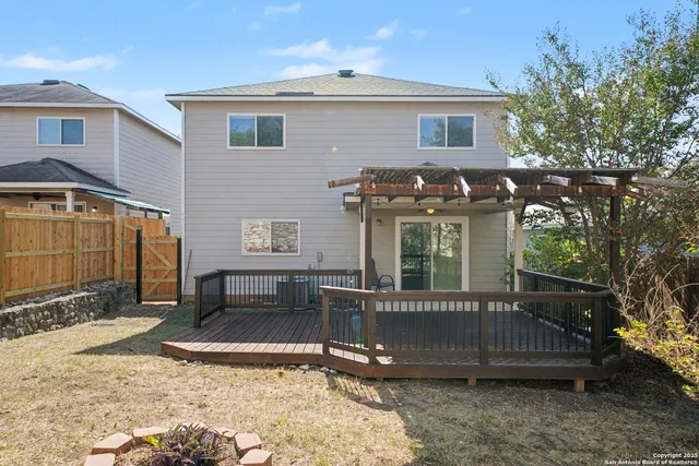 a backyard of a house with yard and outdoor seating