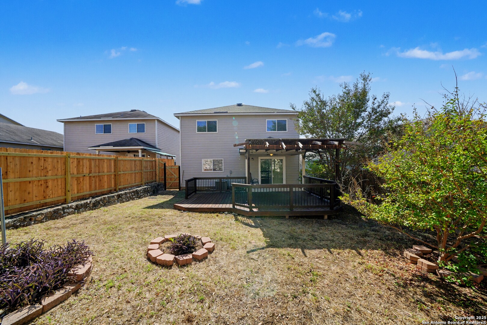 3615 Longhorn Creek San Antonio, TX 78261 - Photo 38 of 42 a backyard of a house with yard and outdoor seating