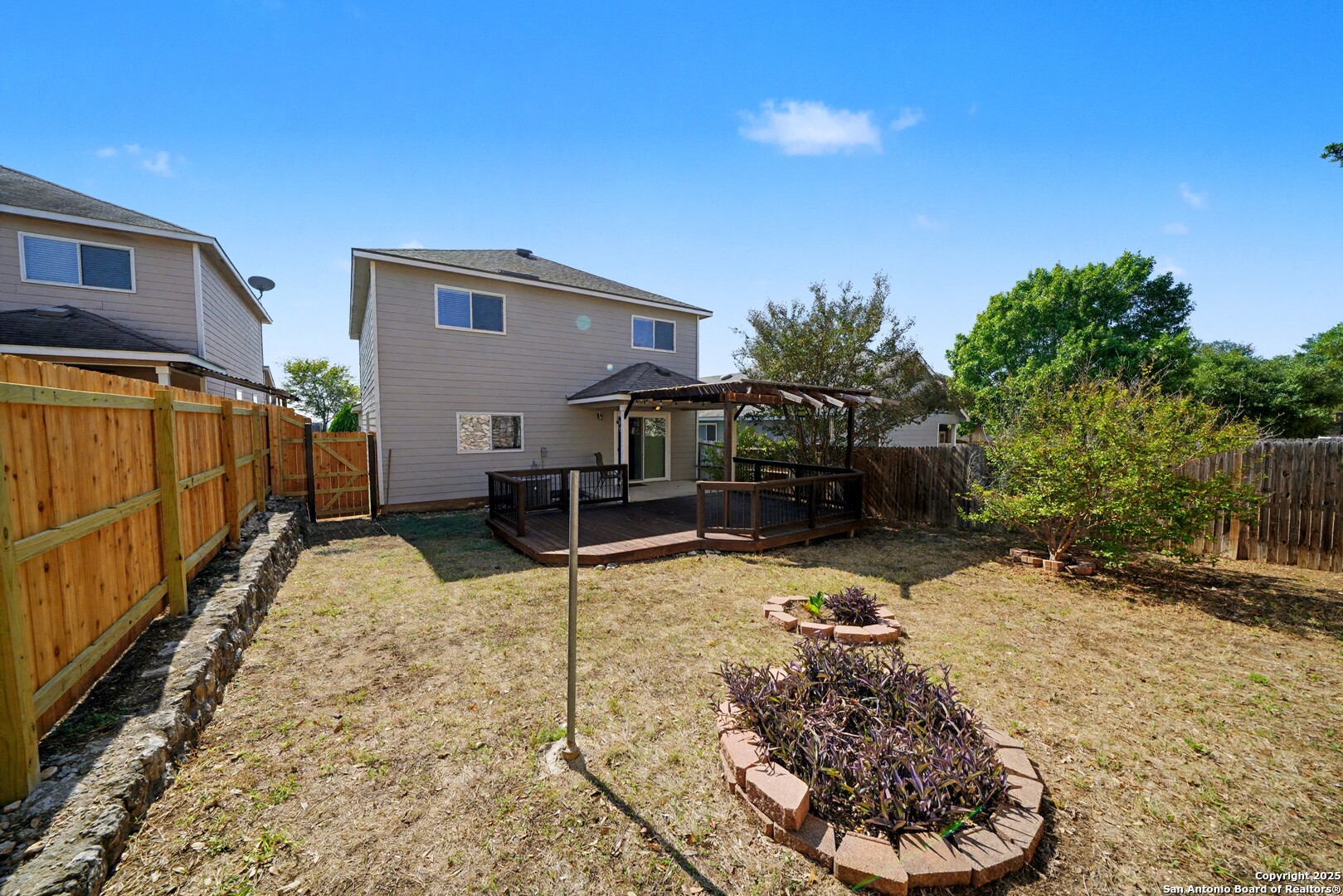 3615 Longhorn Creek San Antonio, TX 78261 - Photo 40 of 42 a view of a backyard with a tree