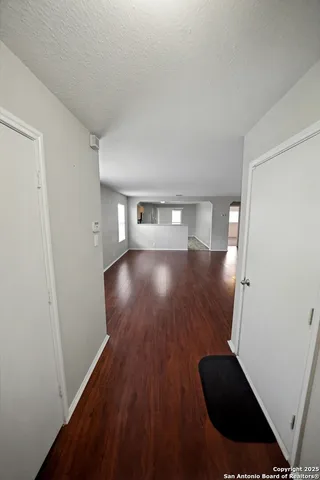 wooden floor in an empty room with a mirror