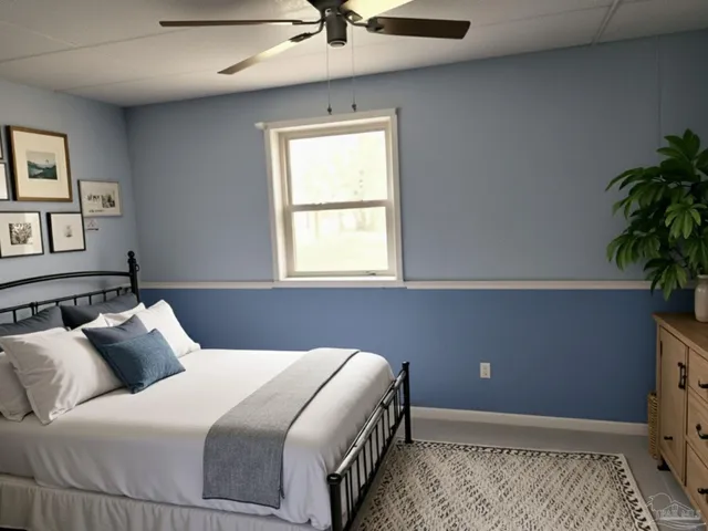 a bedroom with a bed and a potted plant
