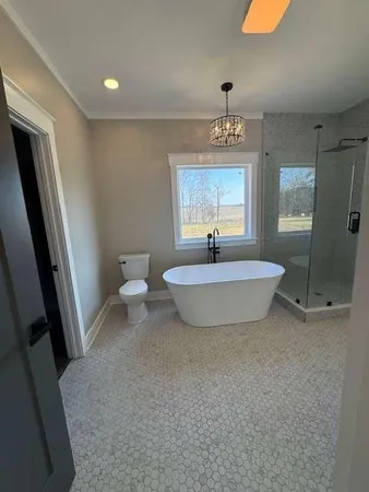 a view of a bathroom with mirror two toilet and a sink