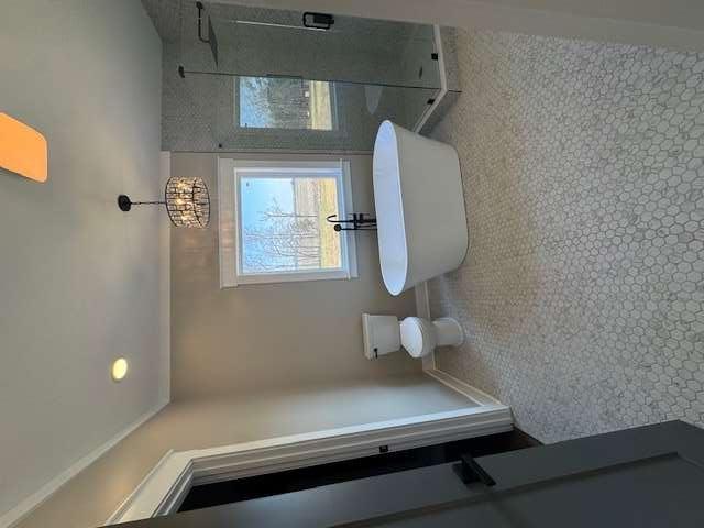 1825 County Road 40, AL 35960 - Photo 12 of 24 a view of a bathroom with mirror two toilet and a sink