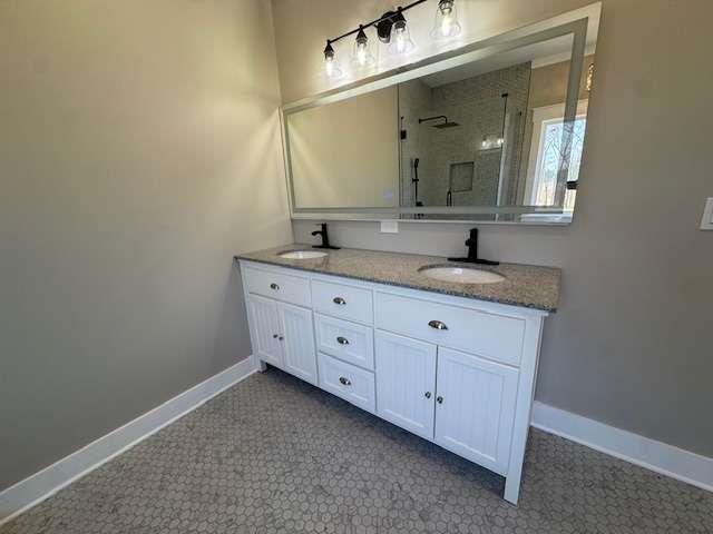 1825 County Road 40, AL 35960 - Photo 13 of 24 a bathroom with a granite countertop sink two large mirror and a