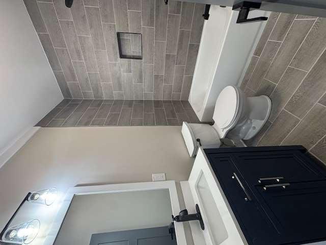 1825 County Road 40, AL 35960 - Photo 18 of 24 a bathroom with a sink a toilet a mirror and bathtub