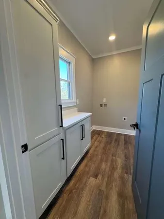 a room with a sink and a mirror