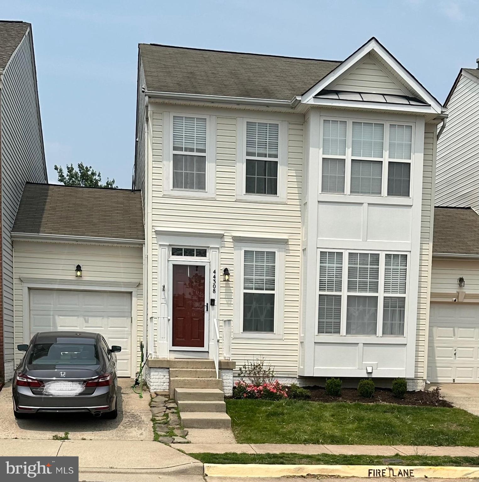 44308 Silkworth Terrace Ashburn, VA 20147 - Photo 1 of 29 a car parked in front of a house