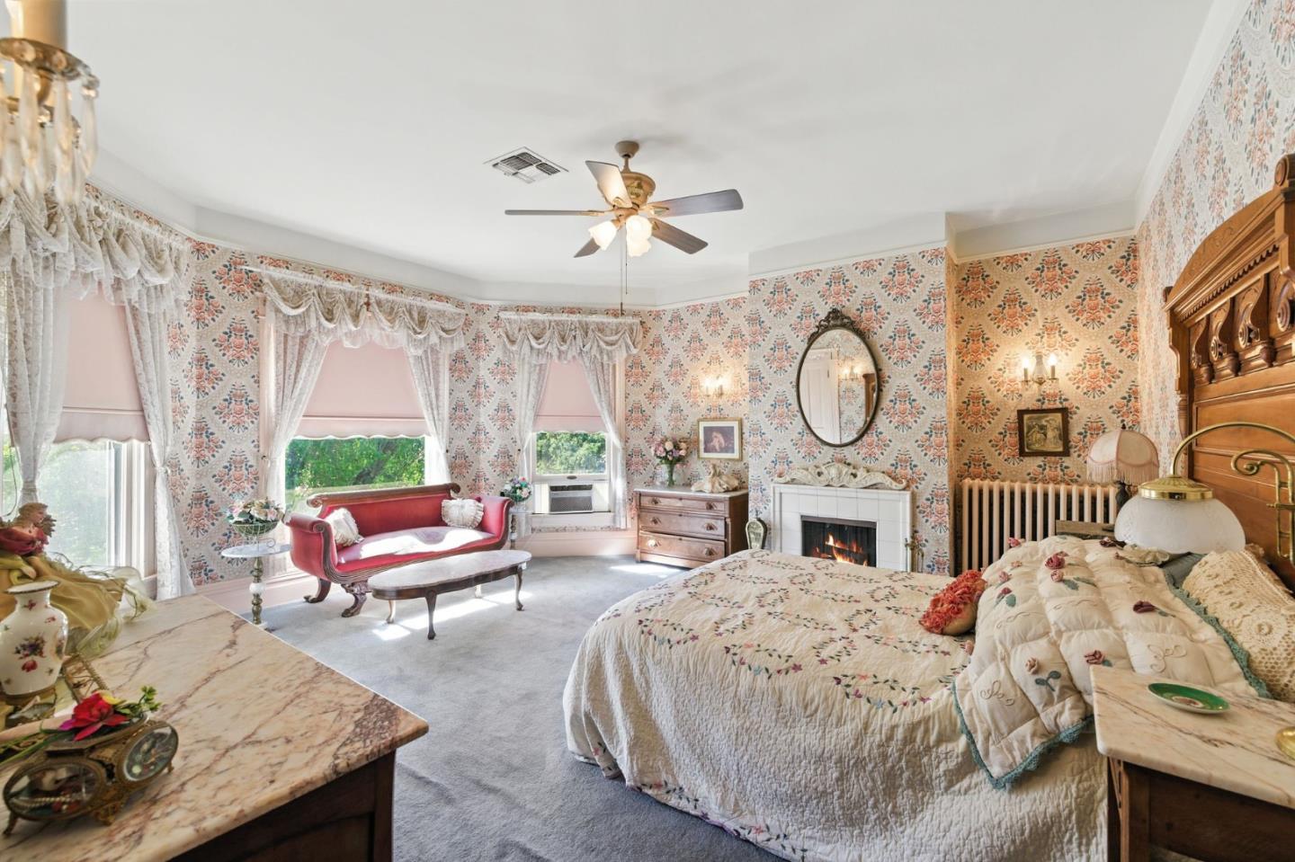 1330 Jackson Gate Road Jackson, CA 95642 - Photo 27 of 72 a bed room with a bed mirror and a chandelier