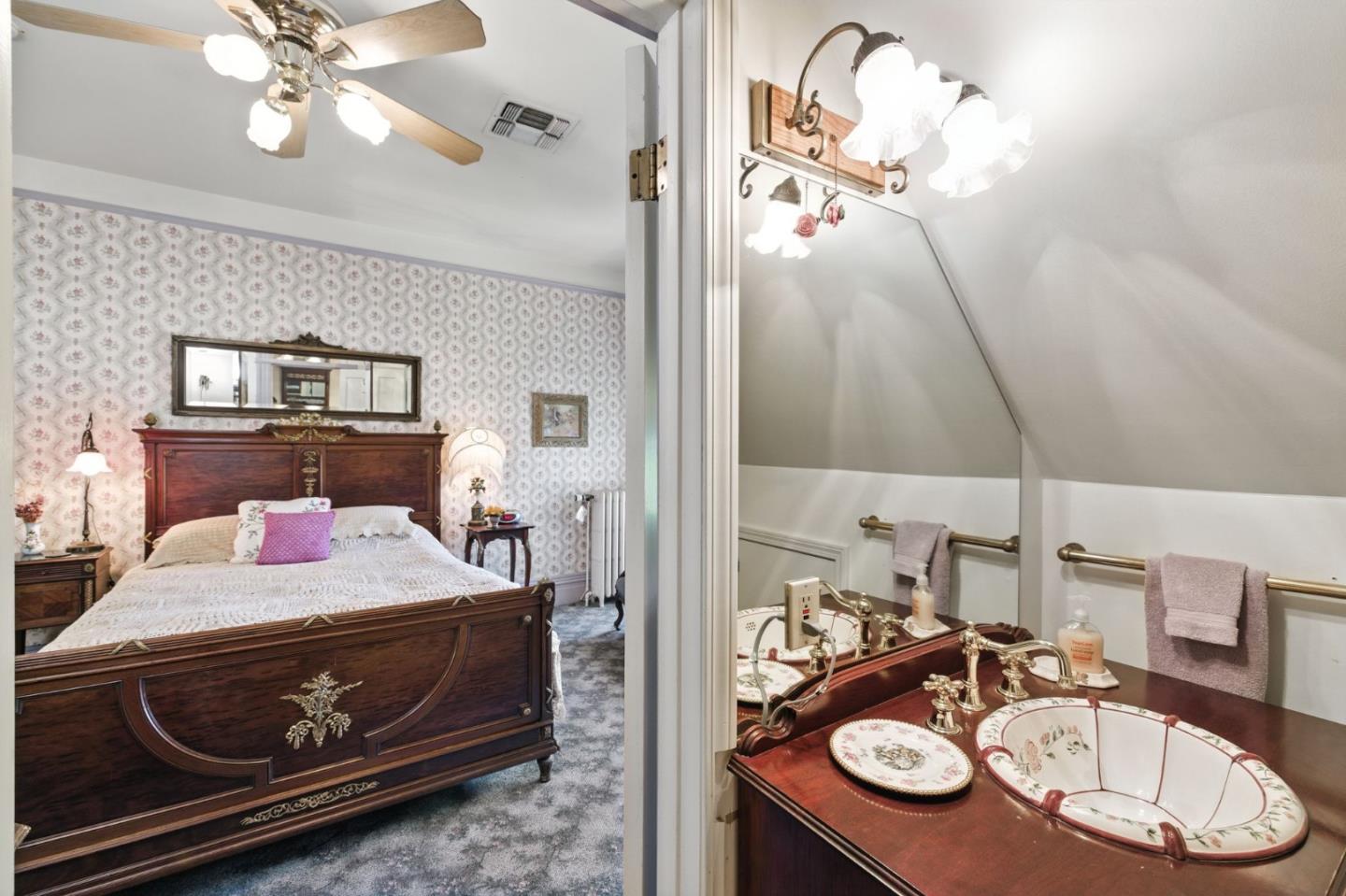 1330 Jackson Gate Road Jackson, CA 95642 - Photo 34 of 72 a bedroom with a bed and chandelier