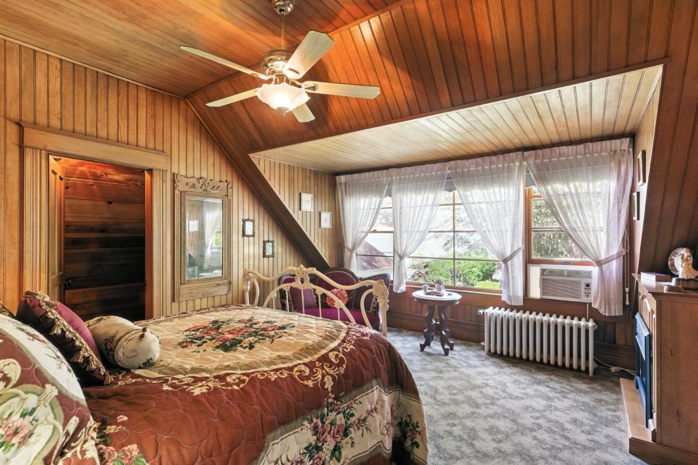 1330 Jackson Gate Road Jackson, CA 95642 - Photo 38 of 72 a bedroom with a bed a chandelier and a window