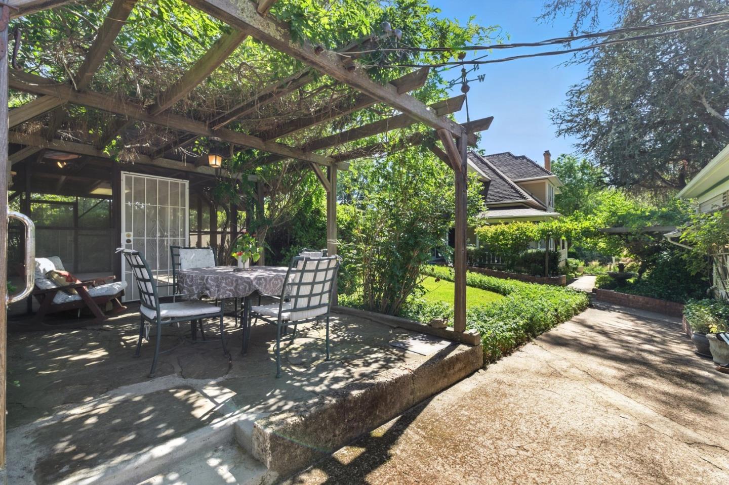 1330 Jackson Gate Road Jackson, CA 95642 - Photo 45 of 72 a view of a patio with table and chairs with wooden floor and fence
