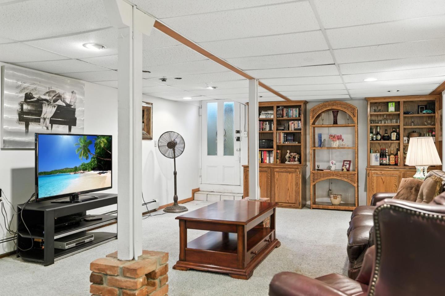 1330 Jackson Gate Road Jackson, CA 95642 - Photo 49 of 72 a living room with furniture a flat screen tv and a wall painting