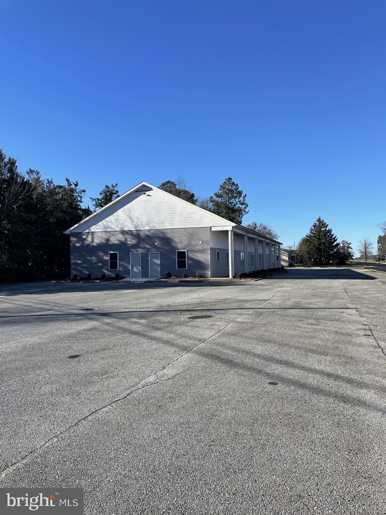 300 Collins Avenue, Unit 3 Hurlock, MD 21643 - Photo 13 of 13 a front view of a house with a yard