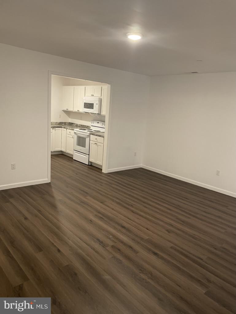 300 Collins Avenue, Unit 3 Hurlock, MD 21643 - Photo 6 of 13 a view of a kitchen with wooden floor