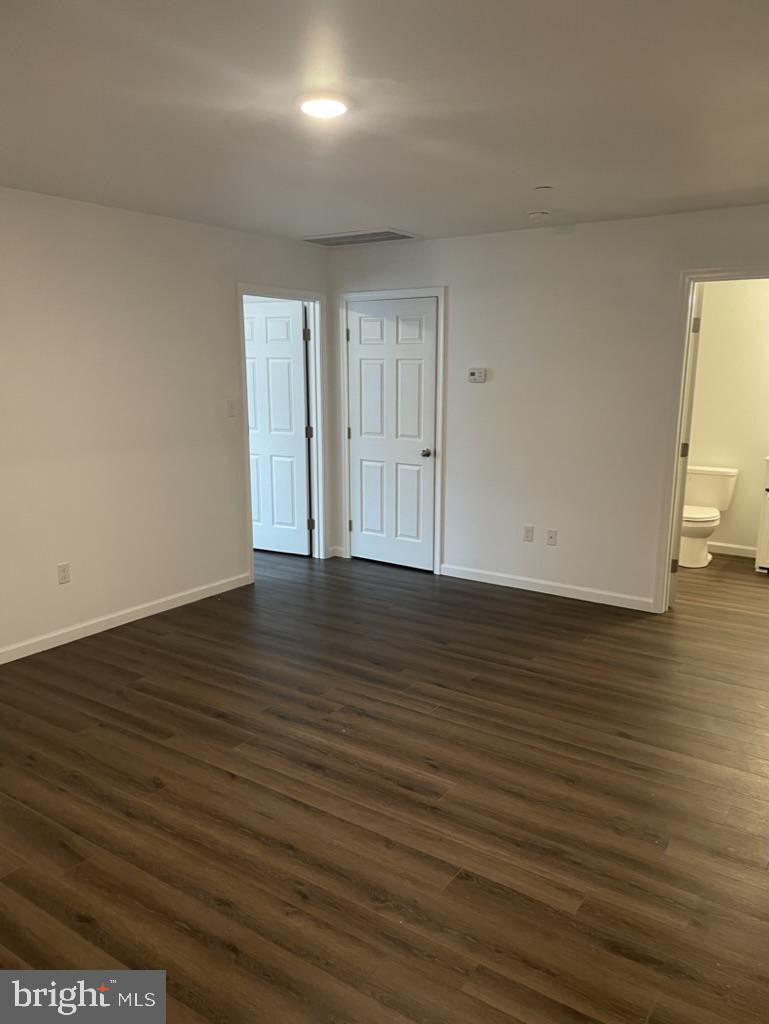 300 Collins Avenue, Unit 3 Hurlock, MD 21643 - Photo 7 of 13 a view of an empty room with wooden floor