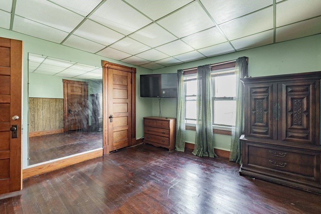 27 Freeman Terrace Springfield, MA 01104 - Photo 16 of 32 an empty room with wooden floor and windows