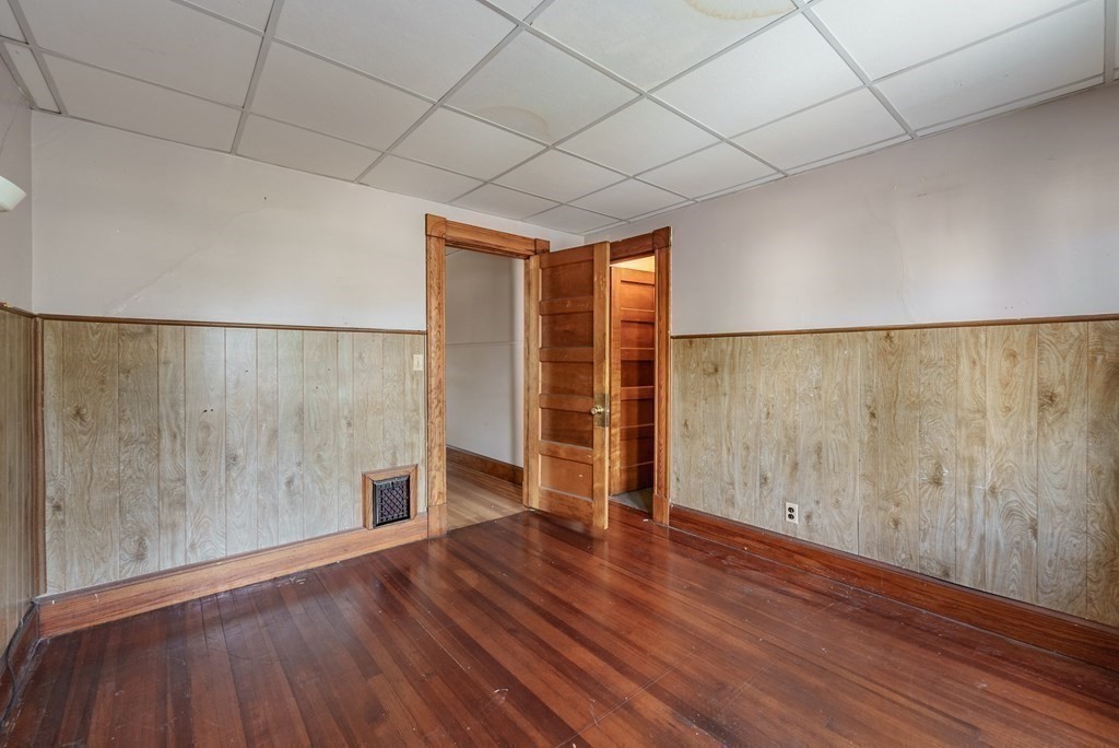 27 Freeman Terrace Springfield, MA 01104 - Photo 18 of 32 wooden floor in an empty room with a window