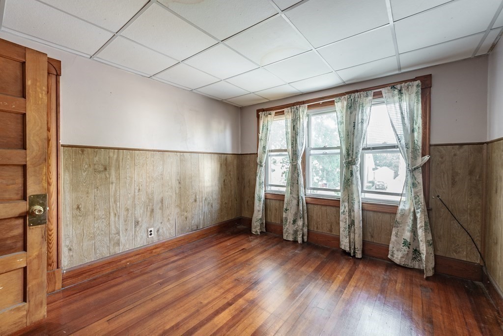 27 Freeman Terrace Springfield, MA 01104 - Photo 19 of 32 a view of empty room with wooden floor and fan