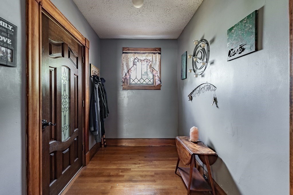 27 Freeman Terrace Springfield, MA 01104 - Photo 6 of 32 a view of a hallway with workspace