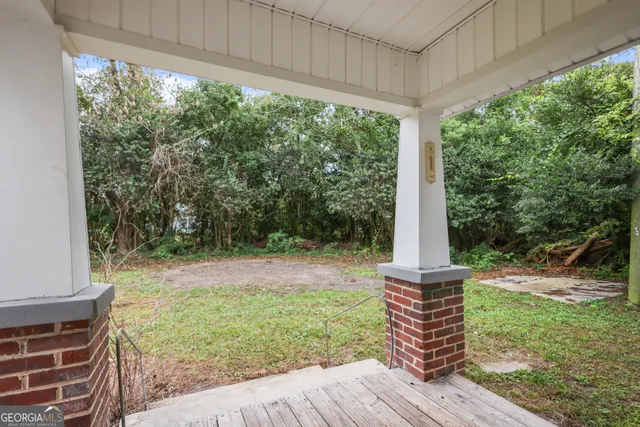 a backyard of a house with lots of green space
