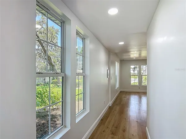 a view of hallway with windows