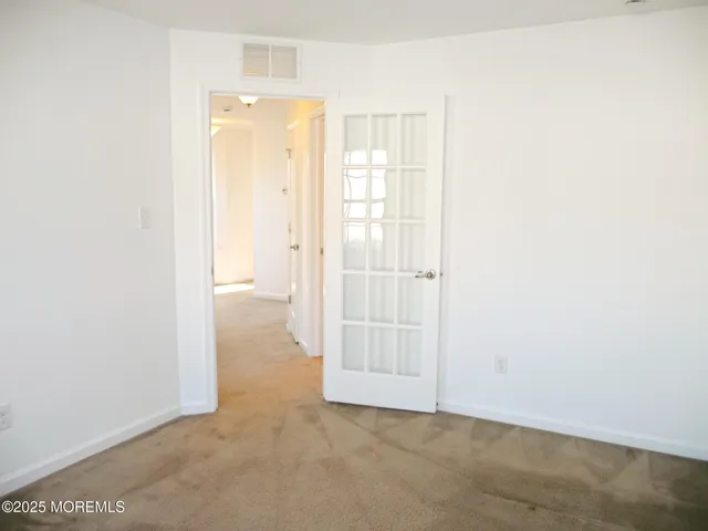 an empty room with a bathroom