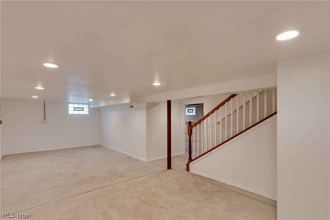 38705 Chardon Road Willoughby Hills, OH 44094 - Photo 27 of 35 Lower Level is finished with moldings, drywall and tons of can lighting and finished ceiling - the flooring is freshly laid, neutral cement flooring - add a rug or use as is for your families needs - finished and delightful