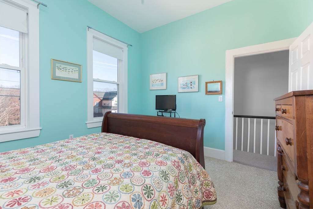 215 Central Street Saugus, MA 01906 - Photo 17 of 41 a bedroom with a bed and a window