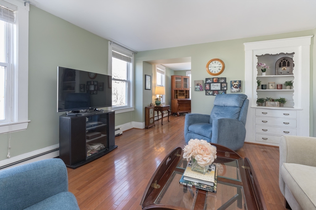 215 Central Street Saugus, MA 01906 - Photo 2 of 41 a living room with furniture and a flat screen tv