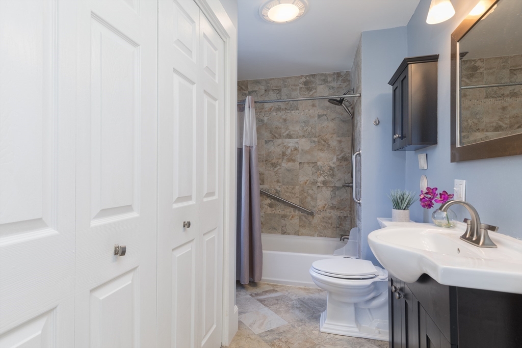 215 Central Street Saugus, MA 01906 - Photo 22 of 41 a bathroom with a sink toilet and shower