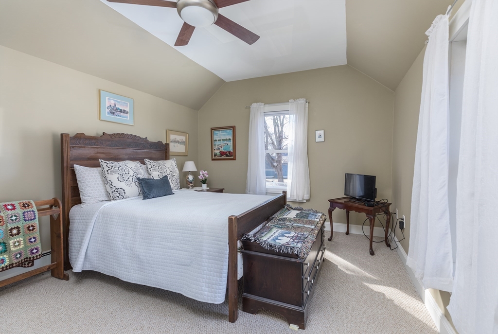 215 Central Street Saugus, MA 01906 - Photo 24 of 41 a bed room with a bed and a chair