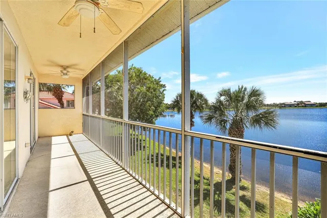 a view of balcony with wooden floor and fence
