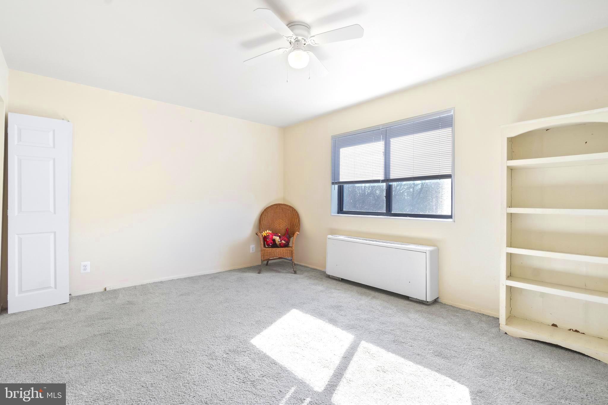 8601 Manchester Road, Unit 513 Silver Spring, MD 20901 - Photo 17 of 31 a room with a window and a dresser