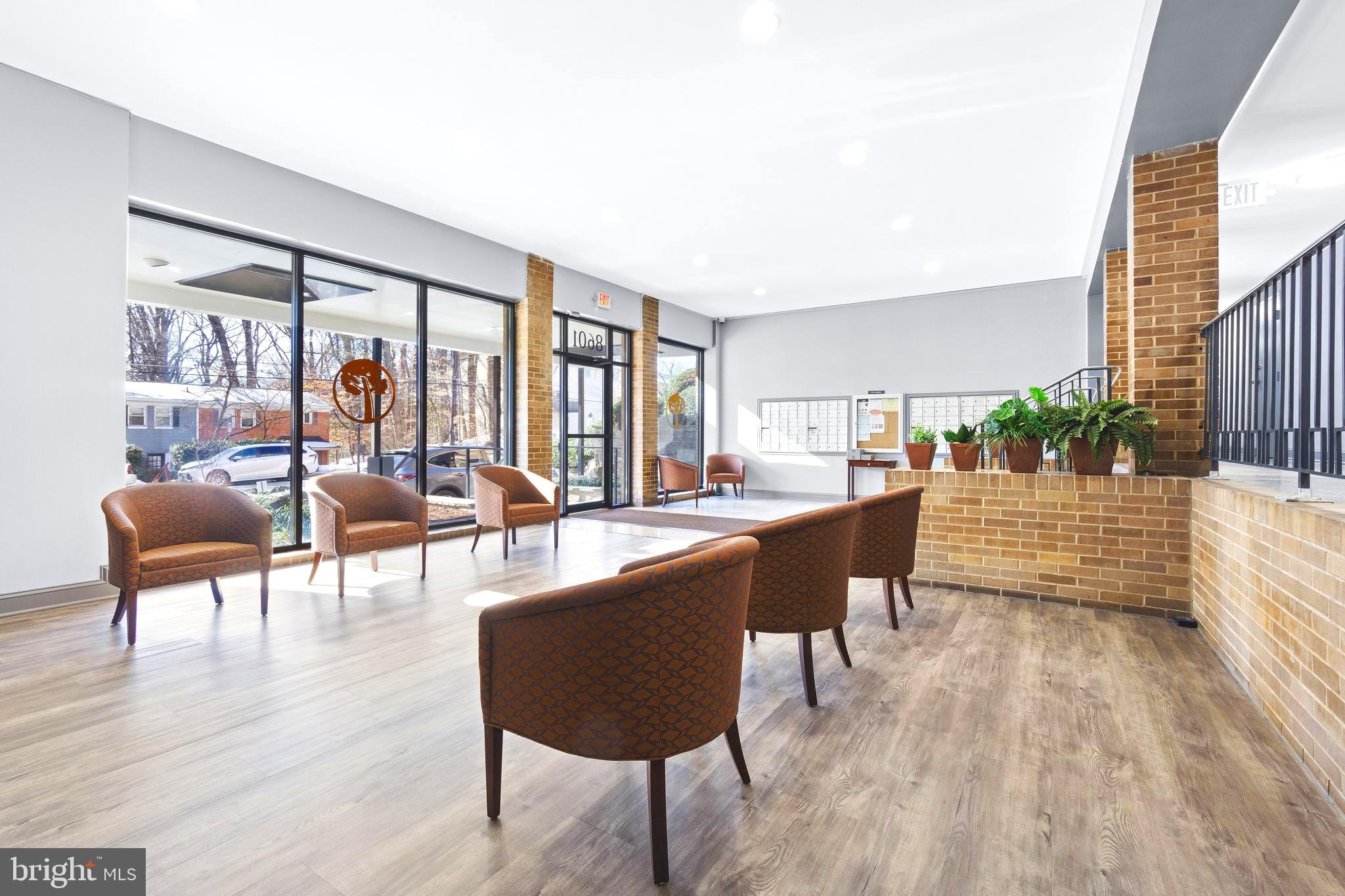 8601 Manchester Road, Unit 513 Silver Spring, MD 20901 - Photo 2 of 31 a living room with furniture and a large window