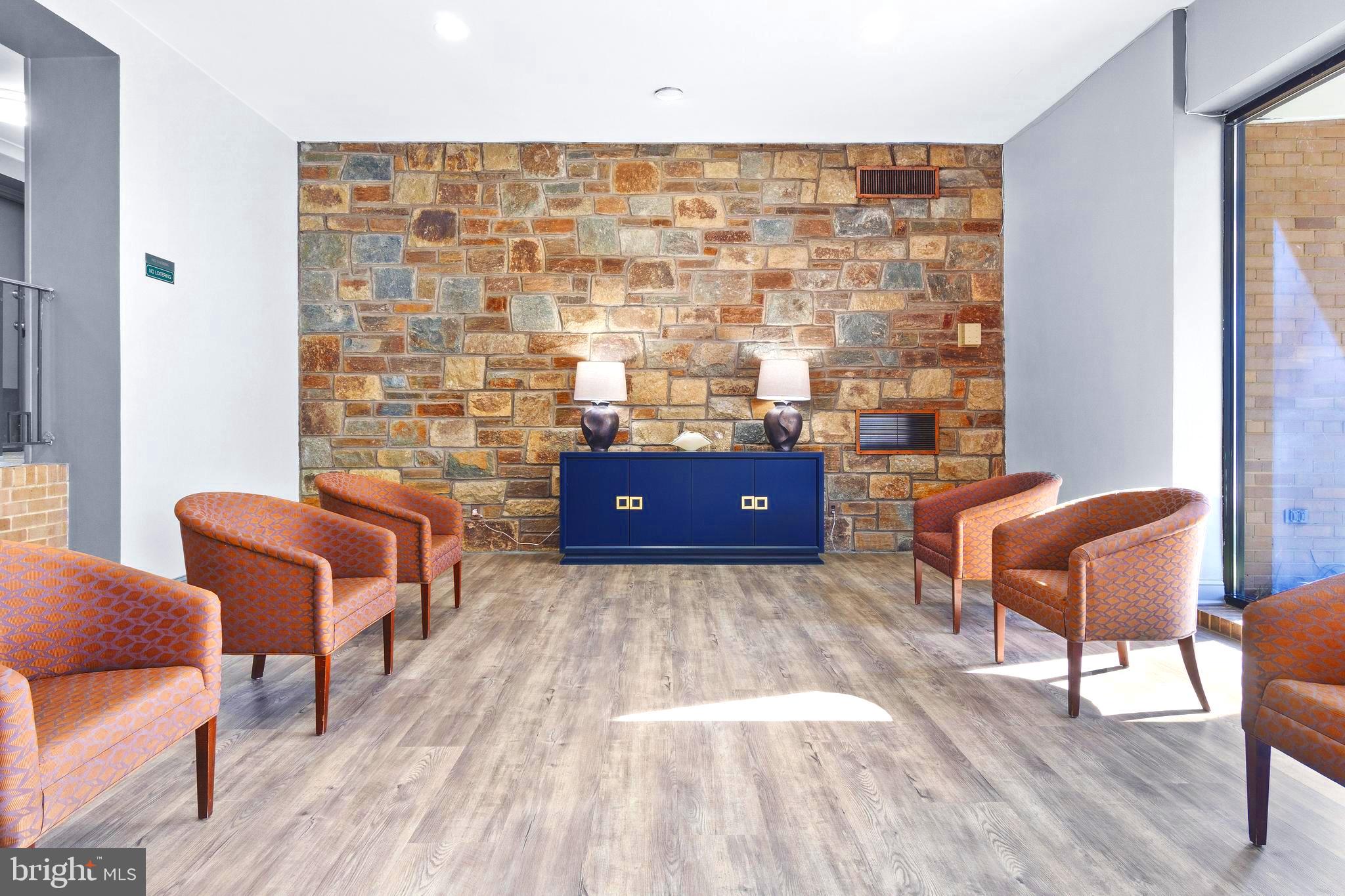 8601 Manchester Road, Unit 513 Silver Spring, MD 20901 - Photo 22 of 31 a living room with furniture and a rug