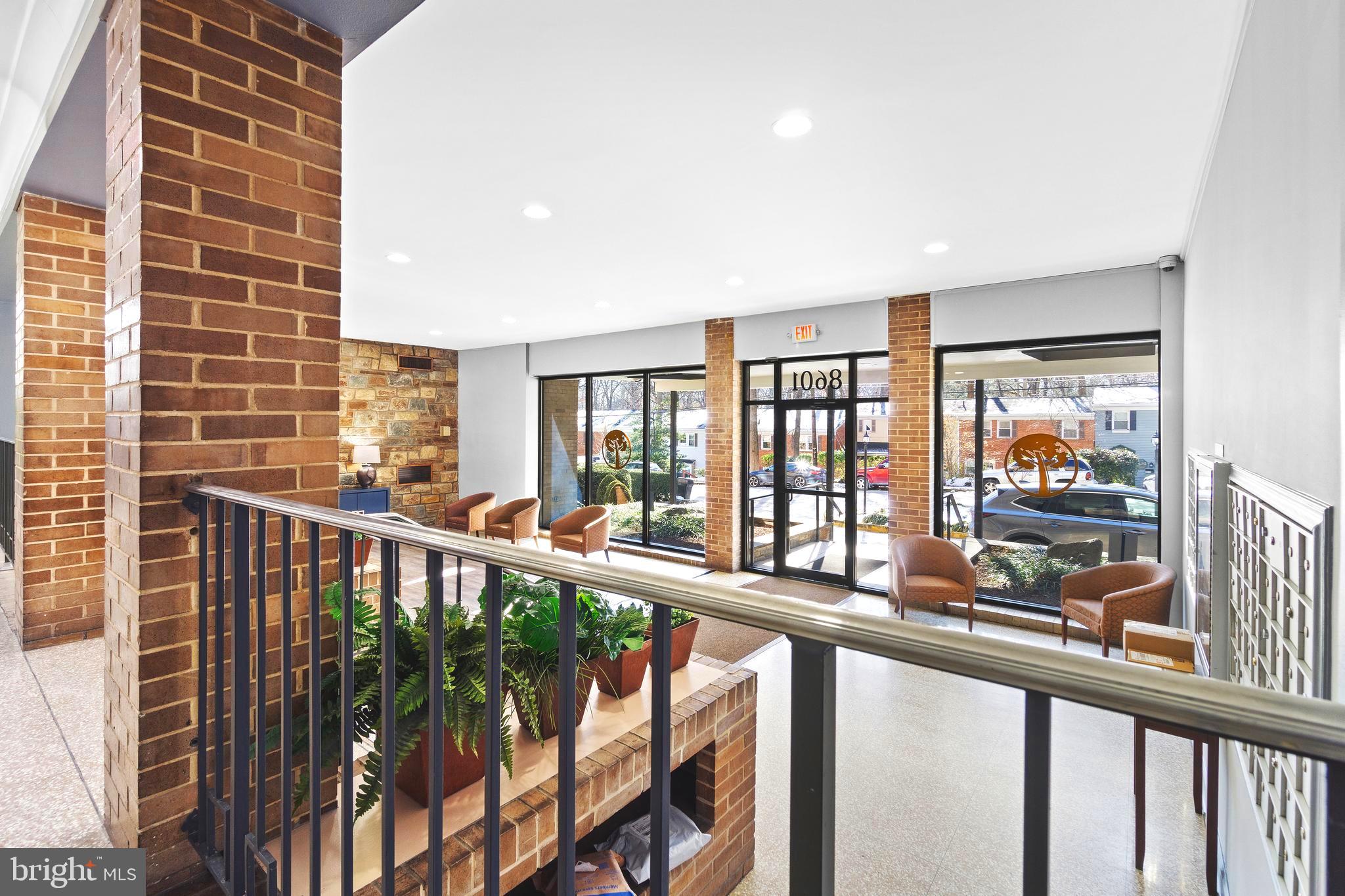 8601 Manchester Road, Unit 513 Silver Spring, MD 20901 - Photo 26 of 31 a view of a balcony with wooden floor and fence
