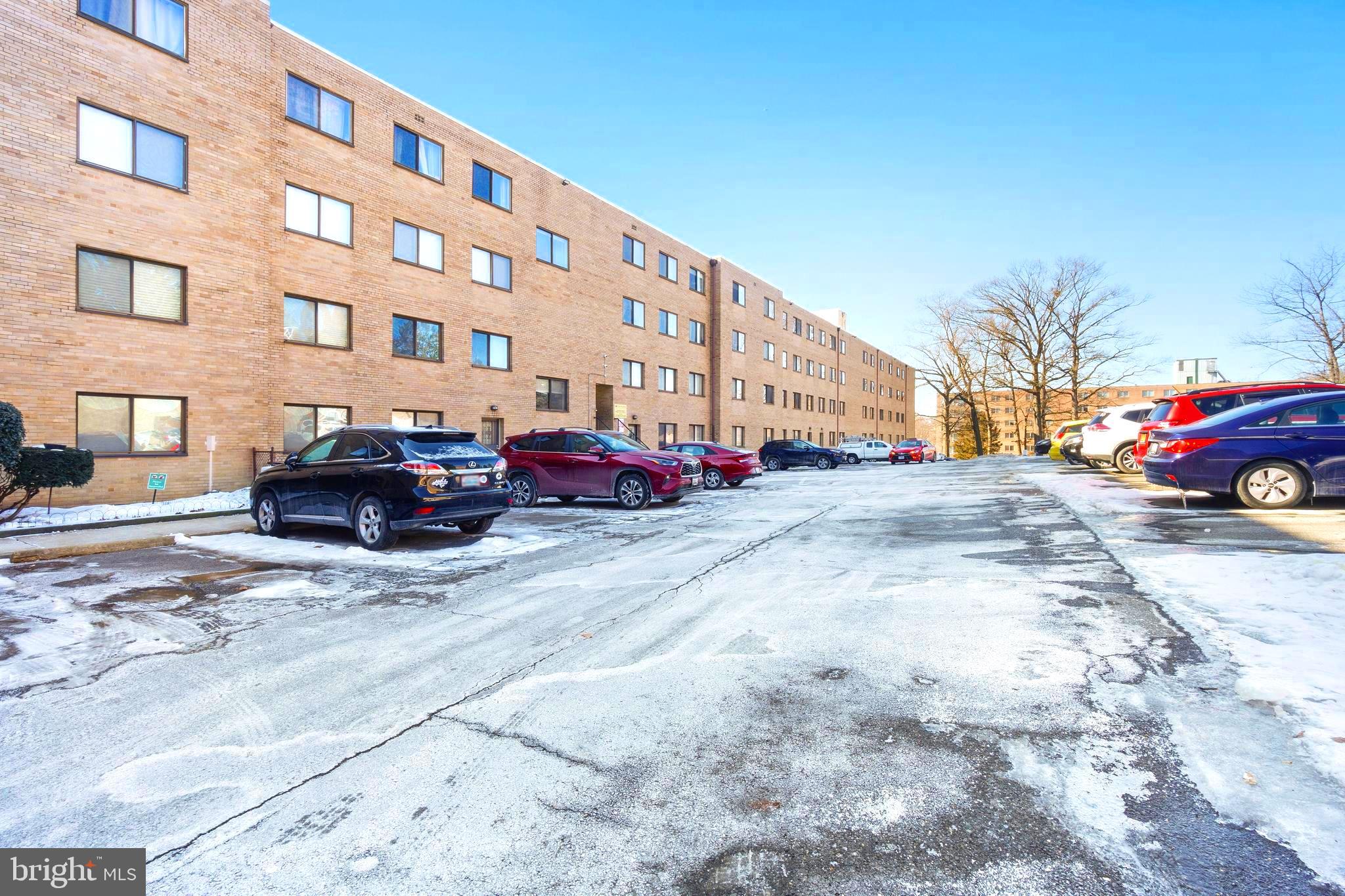 8601 Manchester Road, Unit 513 Silver Spring, MD 20901 - Photo 28 of 31 a cars parked in front of a building