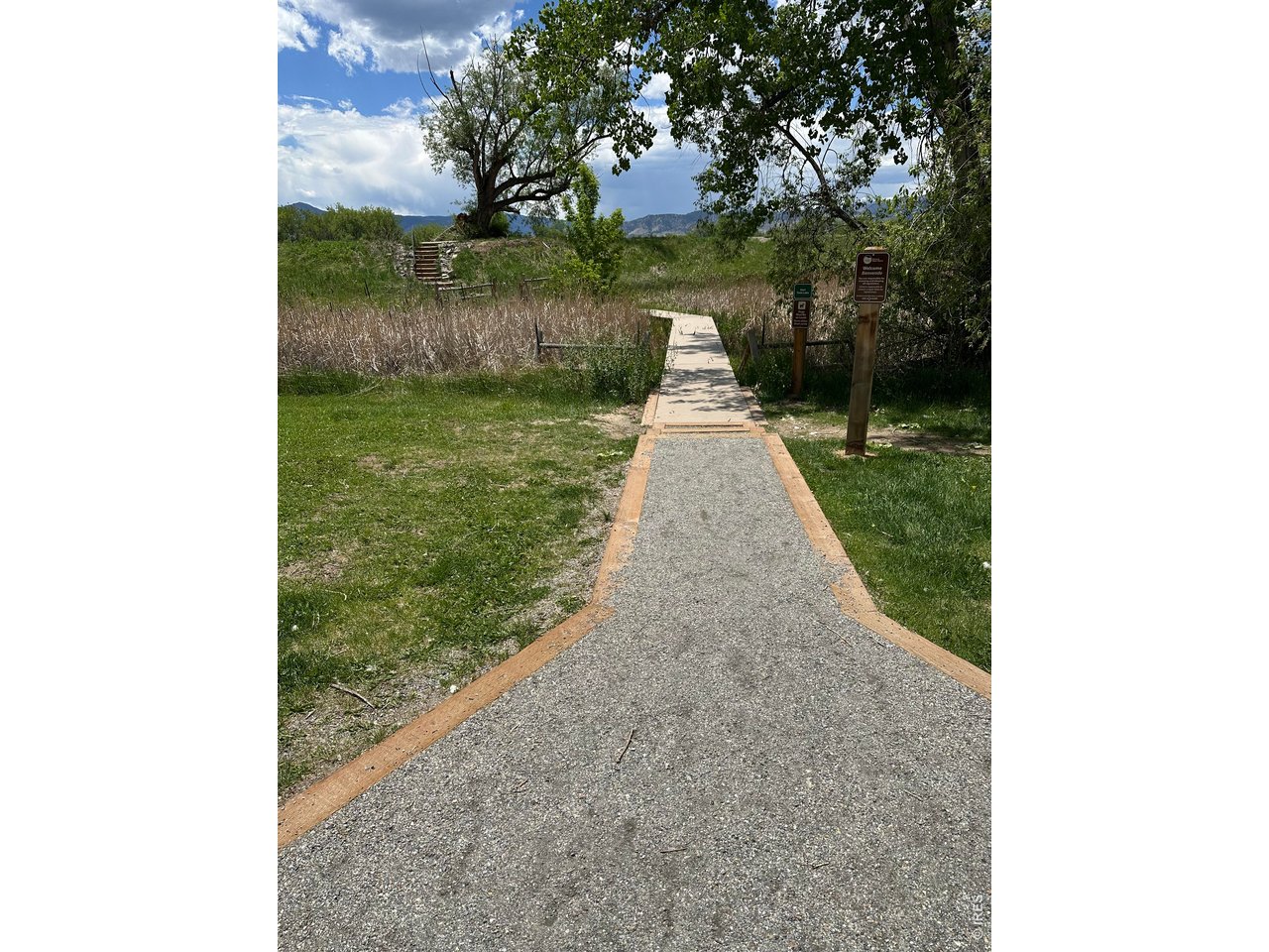 4985 Twin Lakes Road, Unit 94 Boulder, CO 80301 - Photo 26 of 29 This groomed path from the condo community leads across a field of cattails to the lakes and trails.